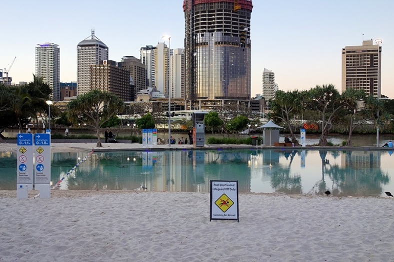 No one swimming at Streets Beach in winter with view across the river to the city.